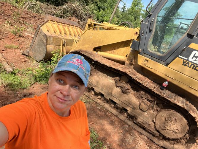 Kayla Gravely said she’s learning to drive heavy equipment, like an excavator. Gravely is the first woman to be hired to work for Oglethorpe County’s road maintenance crew. (Submitted Photo)