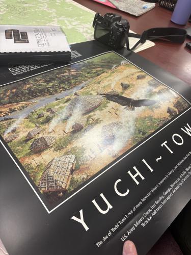 Tom Gresham shows a depiction of a Mississippian-era village at UGA’s Archaeological Laboratory. The layout depicts a village similar to those in the Oconee River Valley, featuring cornfields, storage cribs and earthen mounds where hereditary chiefs lived. (Photo/Jet Rawls)