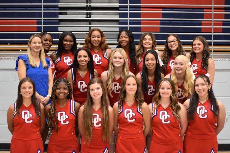 The OCHS cheer team and head coach Morgan Williams pose for media day photos Wednesday, July 23 at OCHS. (Photo/Emma Greene)