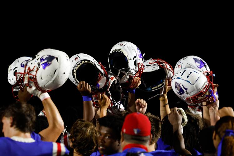 Oglethorpe County football players celebrate together after Oglethorpe County’s game against the East Hill Vikings at Oglethorpe County High School on Saturday, Aug. 23, 2025. The Patriots defeated the Vikings 30-27. (Photo/Sofia Yaker, sofyaker@gmail.com)