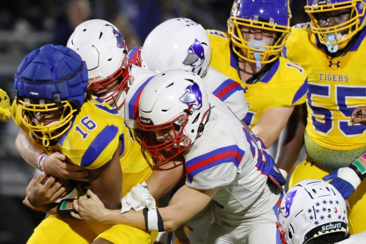 Oglethorpe County High School football players tackle opponent Preston Stokes (16) during a game against Washington Wilkes Comprehensive High School at Tiger Stadium in Washington, Georgia, on Aug. 29, 2025. (Photo/Susanna Johnson)
