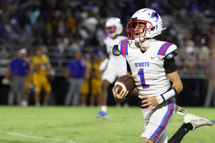 Oglethorpe County High School football quarterback Caden Hartrum (1) runs the ball during a game against Washington Wilkes Comprehensive High School at Tiger Stadium in Washington, Georgia, on Aug. 29, 2025. (Photo/Susanna Johnson)