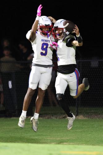 Oglethorpe County High School junior Keyvon Gresham (9) and senior Caden Hartrum (1) celebrate after a touchdown during a game against Washington-Wilkes Comprehensive High School at Tiger Stadium in Washington, Georgia, on Aug. 29, 2025. (Photo/Katherine Davis)