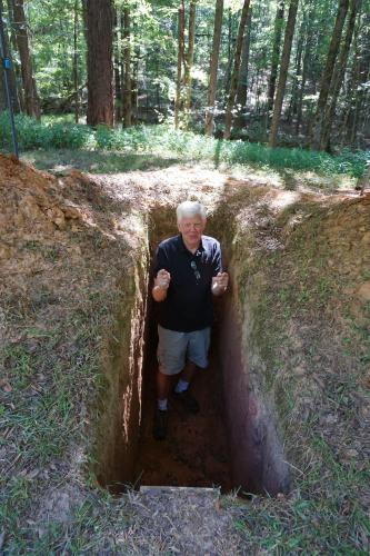 John Fortuna has been digging his own grave for the past year at his property in Lexington. He said he has only a few more inches to go until he reaches 6 feet deep. (Photo/Alex Perri)
