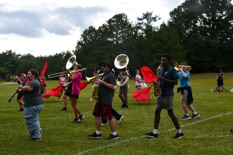 The Oglethorpe County High School marching band practices in early August, heading into the football season. The band will perform a space-themed show called “One Small Step” this year. (Photo/Jennifer Xia)