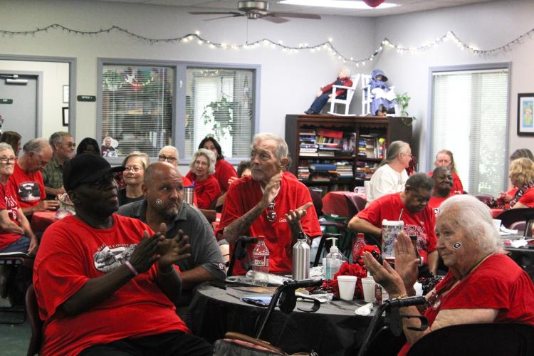 Members of the Oglethorpe County Senior Center cheer on the Georgia Bulldogs during the center's first tailgate party of the season. The UGA Dance Dawgs, cheerleaders and Hairy Dawg also came out to share some Bulldog spirit. (Hannah Freeman/The Oglethorpe Echo)