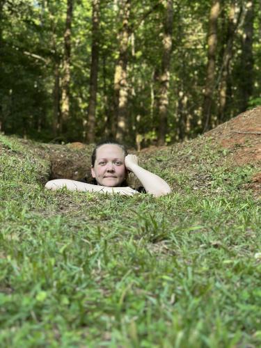 Laura Fortuna, John’s daughter, is one of just a few people who have climbed down in his hand-dug grave. Laura and her dad are comfortable talking about death. (Submitted Photo)