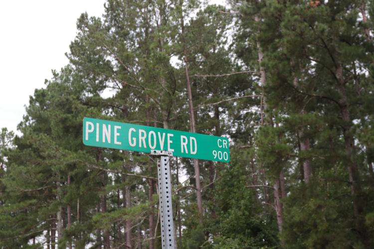 Pine Grove Road's street sign stands in Arnoldsville, Ga, on Aug. 21, 2025. The city council unanimously approved adding waterline upgrades to the road's proposed paving plan. (Photo/Mia Fishman)