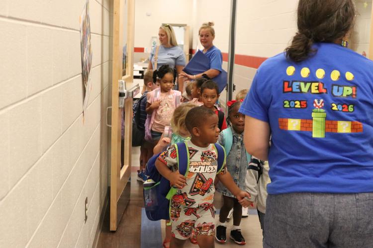 Pre-K students and teachers exit the cafeteria after eating breakfast on the first day of school Aug. 1. (Photo/Anna Izquierdo)