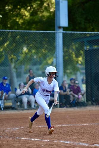 Oglethorpe County senior Reese Campbell enjoys talking about sports with her dad Mike Campbell, who is an assistant with the softball team and coaches the baseball team. Mike said they play badminton in the front yard. (Photo/Ty Johnston)