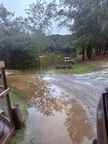 Fabian and Nicole Miranda, who live in Sandy Cross, said the rains submerged their dock and covered most of the driveway that crosses the bridge. The water washed out the area and damaged their coop door, leading to the escape of some of their birds. (Submitted Photo)
