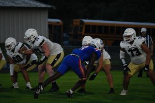 Senior O'Maury Huggs plays in the Patriots’ 30-27 victory over East Hall last Saturday. He played both defensive end and running back in the game. (ANDY MATHIS/THE OGLETHORPE ECHO)