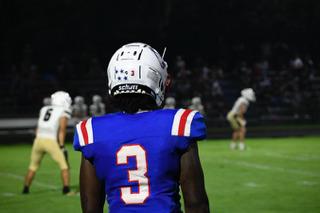 Senior O'Maury Huggs plays in the Patriots’ 30-27 victory over East Hall last Saturday. He played both defensive end and running back in the game. (ANDY MATHIS/THE OGLETHORPE ECHO)
