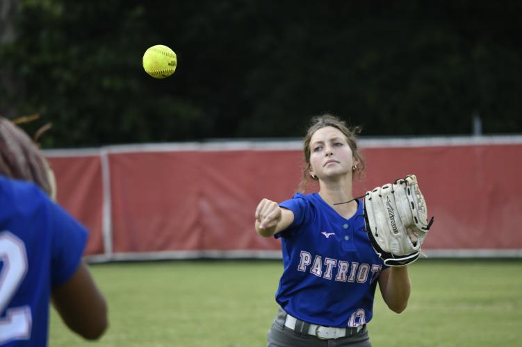 (ANDY MATHIS/THE OGLETHORPE ECHO) Oglethorpe County’s Emily Wisham warms up before a game against Clarke Central last Thursday. Wisham and fellow outfielder Zharia Burgess are two of OCHS’ “most energized players,” coach Brianna Dickens said.