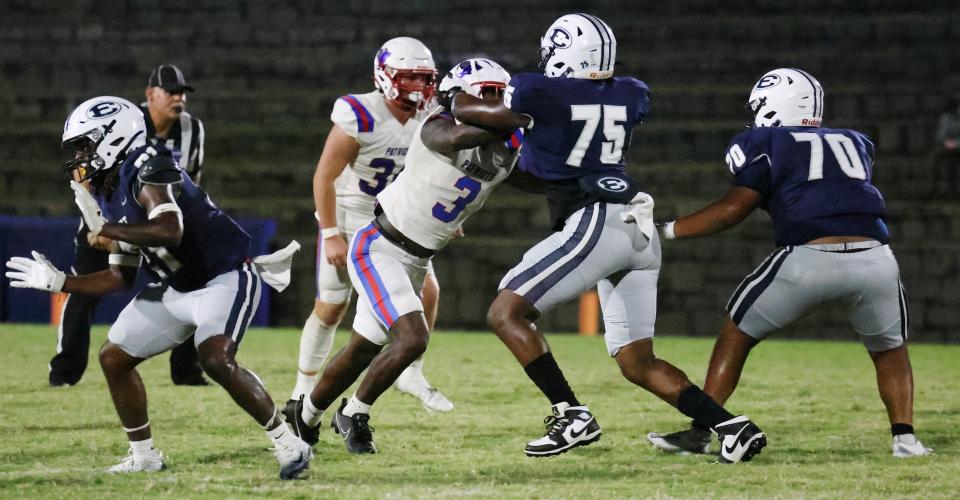 Oglethorpe County High School senior O'Maury Huggs (3) tackles Elbert County High School senior Jaylen Dye (75) in the Granite Bowl on Friday, Sept. 19, 2025. (Photo/Amelia Durden)