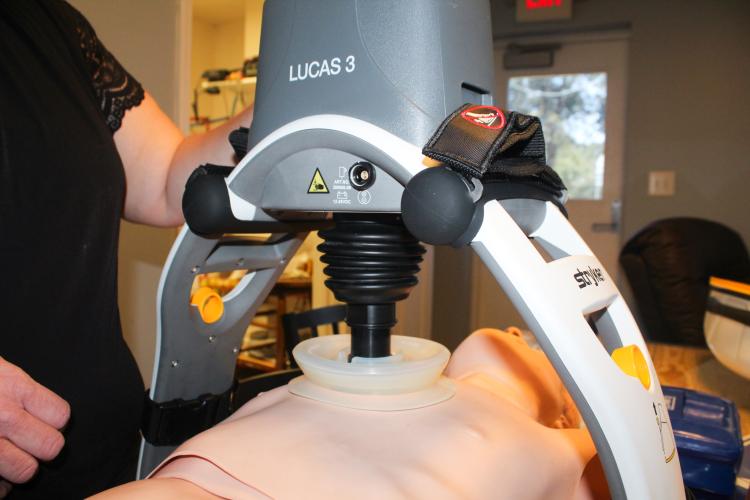 Kristin Gilliam operates a Lucas 3 CPR machine on Thursday, Sept. 11, in Crawford, Georgia. The device provides consistent chest compressions during cardiac arrest, allowing EMS workers to focus on other life-saving tasks. (Photo/Gabrielle Gruszynski)