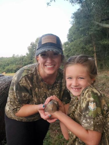 Melissa McCue and daughter Landrie with Landrie's first ever dove. Courtesy photo by Adam Nation (Submitted Photo/The Oglethorpe Echo).