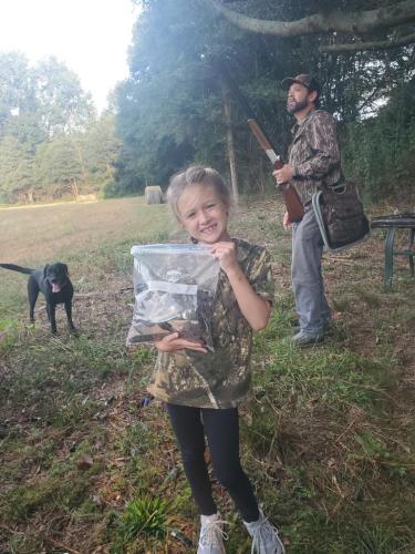 Young hunter Landrie McCue holds a bag full of doves from opening day of dove season this weekend. Courtesy photo by Adam Nation (Submitted Photo/The Oglethorpe Echo).