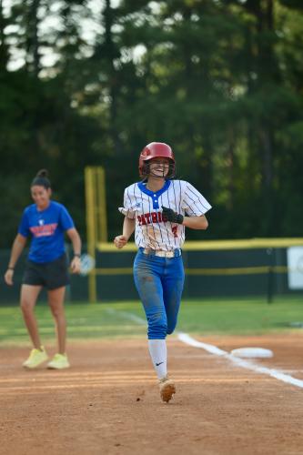 TY JOHNSTON/THE OGLETHORPE ECHO Khloe Eidson is all smiles as she heads for home on Tuesday. She went 4-for-4 with a home run, double and two RBIs to spark a 10-2 win over Commerce.