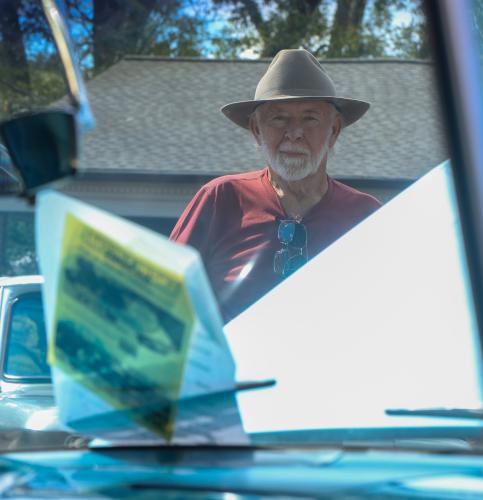 Roy Bell looks through the windshield of his 1958 four-door Chevrolet Bel Air at the Firefly Cruise-In in Lexington, Georgia on Sunday, Sept. 28, 2025. Having originally purchased the car in 2005, Bell sold it in 2015 but bought it back four months ago when he saw it for sale on the internet, as he had always regretted selling it. "I bought it because I learned to drive on a four-door Bel Air, so it was real special," Bell said. (Photo/Susanna Johnson)