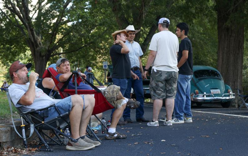 Attendees of Firefly Cruise-In lounge in lawn chairs and chat with friends in Lexington, Georgia on Sunday, Sept. 28, 2025. Vendors sold cold drinks and snacks to guests during the event. (Photo/Susanna Johnson)