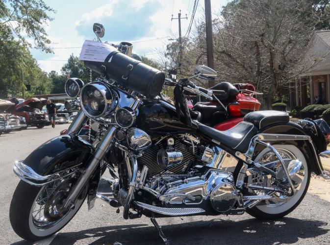 Lamark Baker's 2016 Harley Davidson motorcycle sits on display at the front of the line of vehicles at the Firefly Cruise-In in Lexington, Georgia on Sept. 28, 2025. Baker, who lives in Athens, purchased the motorcyle in 2021. (Photo/Susanna Johnson)