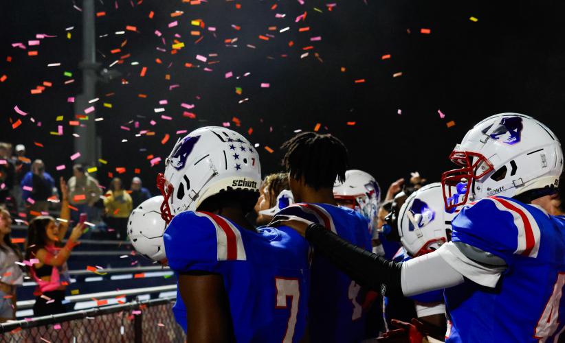 Oglethorpe County High School football players are celebrated with confetti by the student section after winning their home game against Rabun County High School 28-19 on Oct. 10. (Photo/Caroline Newbern)