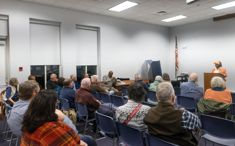 People listen to a presentation by Mamie Hillman, founder and director of the Greene County African American Museum, at a Historic Oglethorpe County meeting at the library on Tuesday. (Photo/Susanna Johnson)