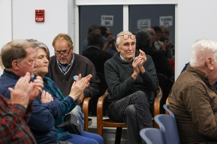 Richard Westmacott and other attendees applaud as Mamie Hillman concludes her presentation on the Greene County African American museum at the library on Tuesday. (Photo/Susanna Johnson)