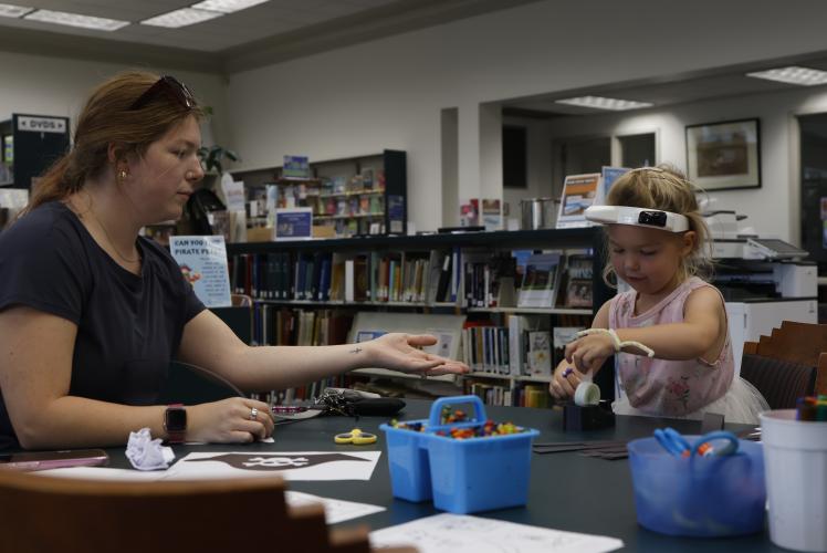 Crawford resident Erica Lillard helps her daughter, Clementine, make a pirate hat during Homeschool Hangout at the Oglethorpe County Library on Friday, Sept. 19, 2025. (Photo / Drew Bearden)