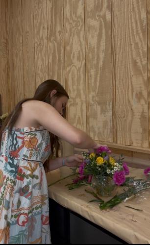 Bridges putting the finishing touches on a floral arrangement. Bridges started and founded her business, Callie's custom design's during her freshman year of high school. (Submitted Photo / Callie Bridges).