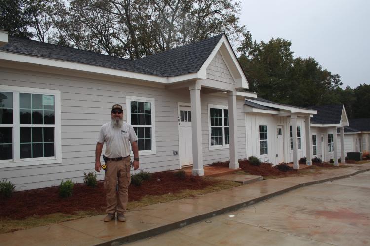 Chad Tracy, CEO of Patriot Construction, stands by Crawford Village’s first phase of 26 two-bedroom and 2½-bath rental units. These units are expected to be complete in 2-3 weeks. (Grace Burnett/The Oglethorpe Echo)
