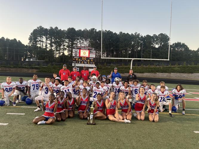 Oglethorpe County Middle School players and cheerleaders celebrate after defeating Social Circle 12–6 to win the PAC-11 championship last week. The Patriots didn’t allow more than six points in any of the final four games.