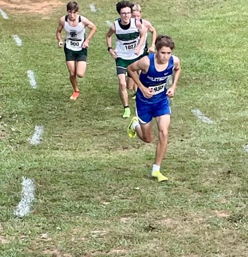 John Adams runs on his way to setting a personal best time of 17:38.86 for the Oglethorpe County cross country team in a meet at Athens Academy on Saturday. He finished 12th among individuals. (Photo Submitted)