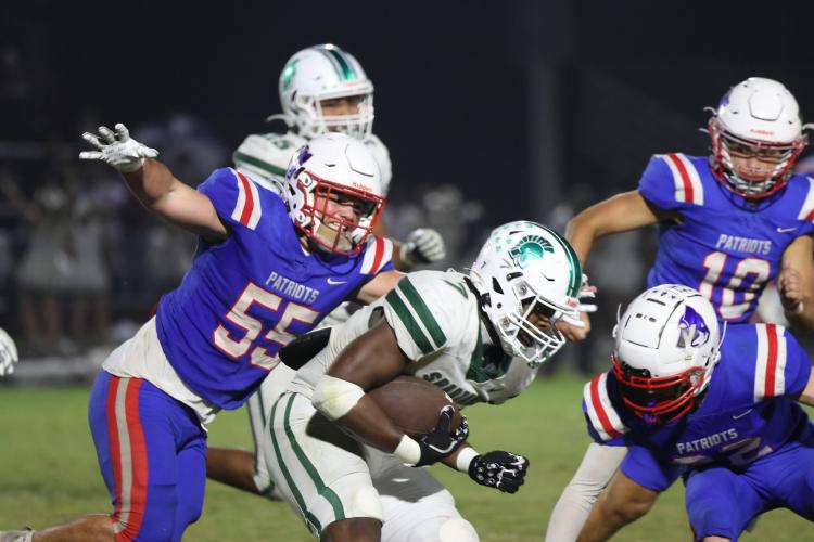 Oglethorpe County's Coleton Sexton, 55, looks to tackle Athens Academy's Zay Prince during the football game on Friday, Sept. 26, 2025 in Lexington, Georgia.  (Photo/Emma Peterson)