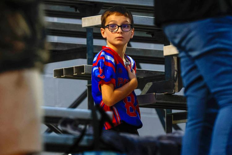 Lucas Patton, 9,  stands for "The Star-Spangled Banner" before Oglethorpe County High School's home game against Athens Academy on Friday, Sept. 26, 2025, in Lexington, Georgia.  (Photo/Caroline Newbern)