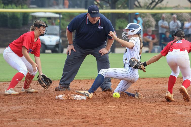 Oglethorpe County High School sophomore Maebrynn Reeves (7) and junior Khloe Eidson (2) attempt to get Prince Avenue Christian School freshman Finley Thomas (1) out during a softball game in Bogart, Georgia on Saturday, September 27, 2025. Prince beat Oglethorpe 11-3.  (Photo/Susanna Johnson)