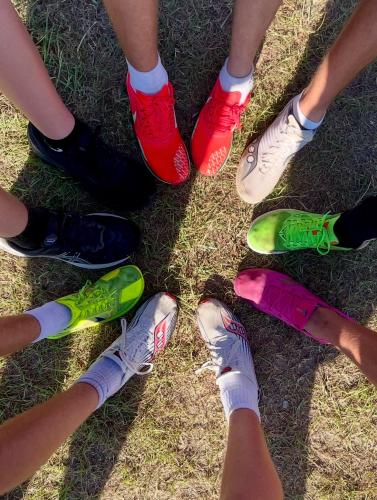 Members of the OCHS cross country team show off their new running shoes, thanks in part to donations and a sponsorship from J&amp;J Chemical in Crawford. The team will compete at Athens Academy next week. (Submitted Photo)