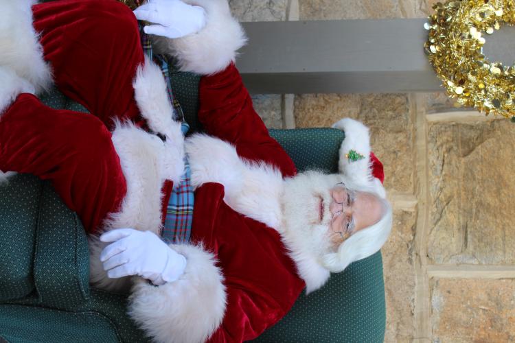 Santa sits in his chair waiting for children to take photos with him at the Christmas Marketplace. Santa and Mrs. Claus were available for pictures for two hours on Sunday. (Photo/Emily Adams)