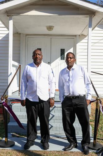 Fred Davenport and Ronald Johnson pose for a photo outside St. Paul Methodist Church in Lexington on Sunday, Nov. 16, 2025. Johnson has been a part of the group working to reopen the church. (Photo/Susanna Johnson)