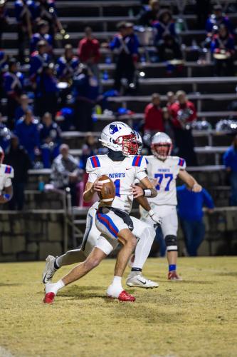 (TY JOHNSTON/THE OGLETHORPE ECHO) Caden Hartrum looks for a receiver during Friday’s loss to Elbert County. He finished the season with six touchdowns passing and nine on the ground.
