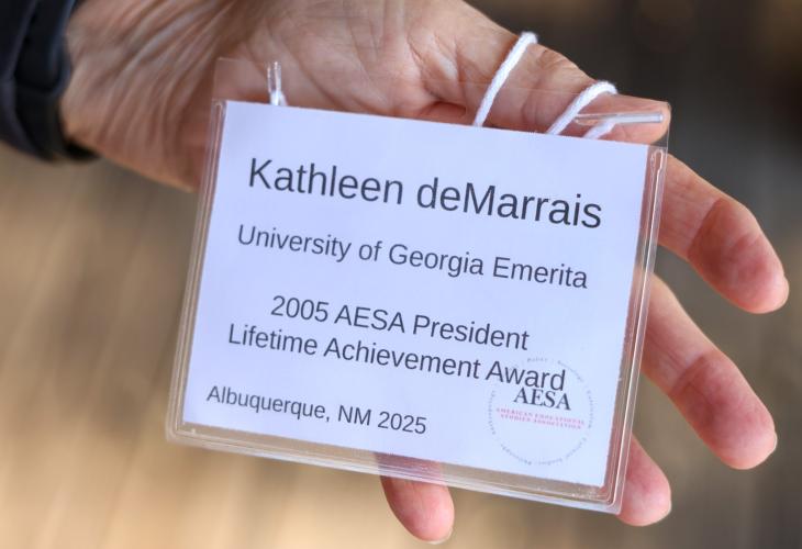 Kathleen deMarrais holds her name tag from AESA's 2025 conference held in Albuquerque. Having retired from teaching at the University of Georgia 3 years ago, deMarrais holds the title of Professor Emerita. (Photo/Susanna Johnson)