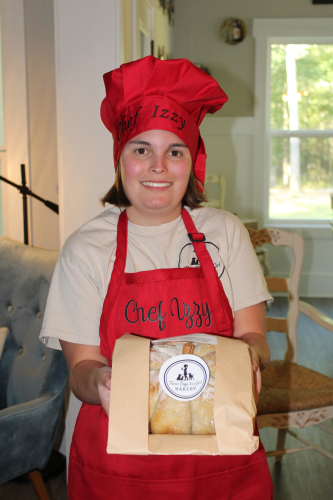 Izzy Marler’s bakery menu features sourdough breads, bagels, muffins, cookies and dog treats. The menu also features seasonal items, such as the Rustic Pumpkin-Shaped Sourdough. (Emily Adams/The Oglethorpe Echo)