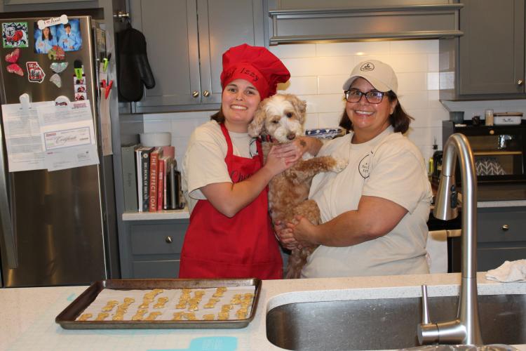 Izzy (left) and Tania Marler enjoy bonding over baking for Three Dogs and a Girl Bakery. Izzy serves as CEO and Tania assists with tasks, such as posting on social media. (Emily Adams/The Oglethorpe Echo)