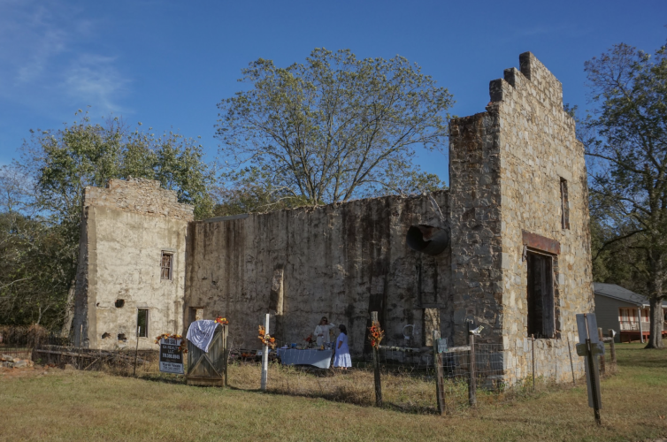 Realtor Martii Moats and her mentor Melisa McCue host an open house for the historic Arnold Cotton Gin on Railroad Street in Arnoldsville. Moats envisions someone could turn the property into a microbrewery or event venue. (Alex Perri/The Oglethorpe Echo)