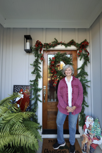 Mary Ann Cox, who lives in Crawford, incorporates her artwork into her seasonal style. This year, she compiled winter and holiday paintings and printed a small booklet to send to loved ones. (Photo/Maia Capuano)