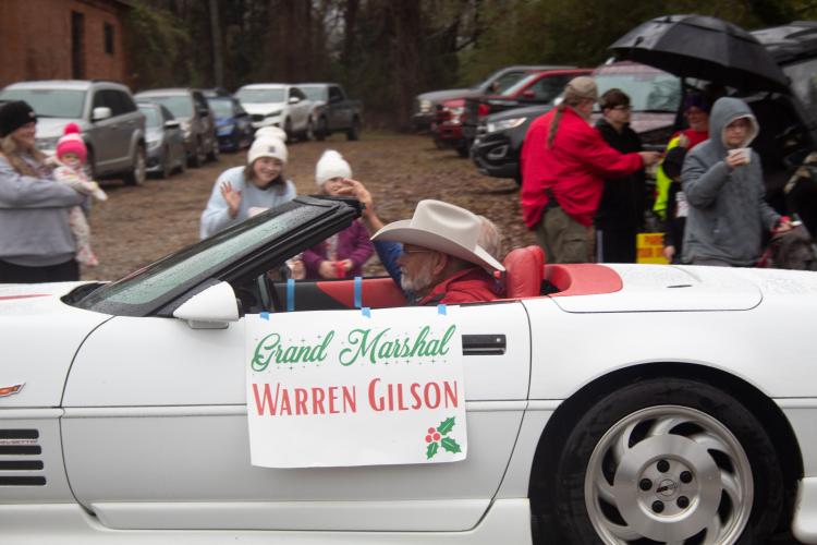 Warren Gilson, Grand Marshal for the parade, rides alongside Kirby Beggs during the Maxeys Christmas Parade. Gilson previously served as Maxeys mayor. (Grace Burnett/The Oglethorpe Echo)