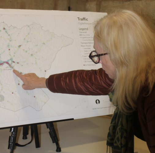 Evelyn Reece, Lexington mayor,  examines the traffic map at the county comprehensive plan open house at the Crawford Depot on Jan. 20. The map shows 2025 traffic patterns and traffic incidents along major roads in the county.  Reece is concerned about traffic along U.S. Highway 78. (BRIDGET GOODMAN/THE OGLETHORPE ECHO)