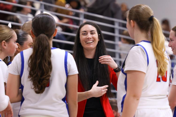 Oglethorpe County High School girls basketball coach Brianna Dickens talks to the Patriots during a timeout on Feb. 10. The Patriots lost to the Blue Devils with a score of 40-58. (Photo/Addison Simmons)