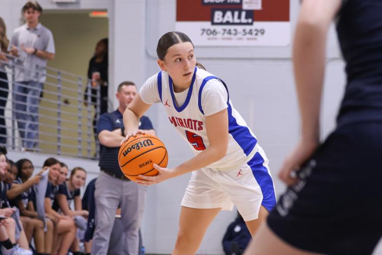 Oglethorpe County player Marin Sampson gets ready to pass the ball on Feb. 10. The Patriots lost to the Blue Devils with a score of 40-58. (Photo/Addison Simmons)